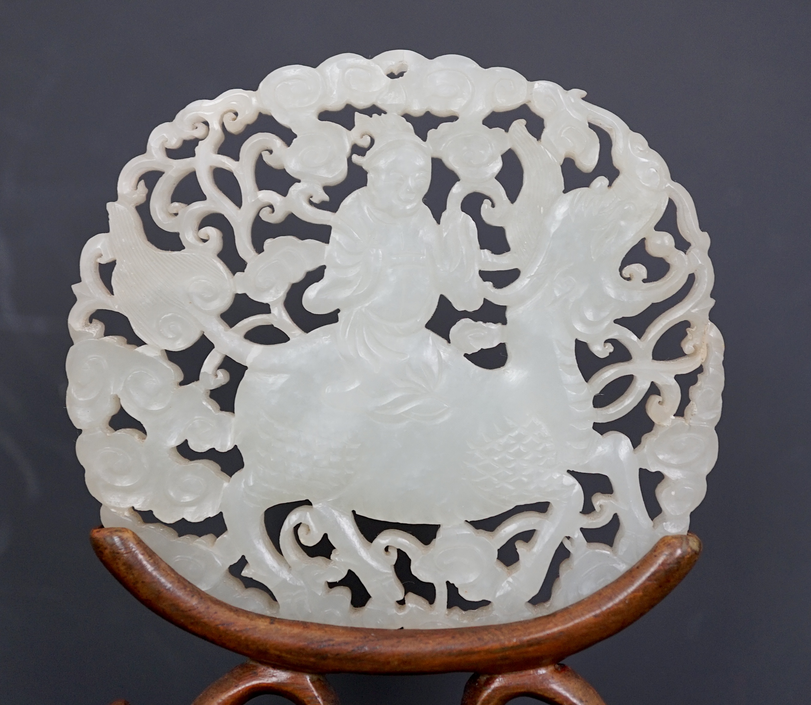 A Chinese white jade ‘qilin and rider’ plaque, 18th/19th century